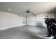 Spacious garage with epoxy floor and motorcycle at 9733 E Clinton St, Scottsdale, AZ 85260