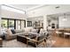 Spacious living room flowing into a kitchen and dining area, creating an ideal space for entertaining guests at 9733 E Clinton St, Scottsdale, AZ 85260