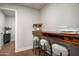 Bright office with a live edge desk and three stools at 9733 E Clinton St, Scottsdale, AZ 85260