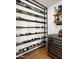 Contemporary wine cellar with black metal shelving, and a beverage cooler at 9733 E Clinton St, Scottsdale, AZ 85260
