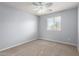 Neutral bedroom featuring a window with blind and baseboard molding at 10055 E Isabella Ave, Mesa, AZ 85209