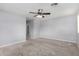 Spacious bedroom featuring neutral carpet, a ceiling fan, and ample natural light at 10055 E Isabella Ave, Mesa, AZ 85209