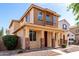 Charming two-story home featuring a cozy front porch and manicured landscaping at 10055 E Isabella Ave, Mesa, AZ 85209