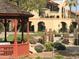 Beautiful gardens and walkways near the building, showcasing manicured landscaping and charming structures at 10330 W Thunderbird W Blvd # B103, Sun City, AZ 85351