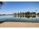 Scenic lake view featuring calm waters, lush greenery, and clear blue skies, ideal for recreation at 10330 W Thunderbird W Blvd # B103, Sun City, AZ 85351