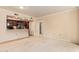 Open concept living room with adjacent kitchen features, carpet, and neutral paint at 10330 W Thunderbird W Blvd # B103, Sun City, AZ 85351