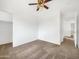 Comfortable bedroom features carpeted floors, ceiling fan, and a closet at 1078 E Poncho Ln, San Tan Valley, AZ 85143