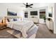 Comfortable main bedroom with a king bed, soft rug and lots of natural light at 1078 E Poncho Ln, San Tan Valley, AZ 85143
