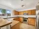 Functional kitchen with wood cabinets, stainless steel appliances, and ample counter space at 1078 E Poncho Ln, San Tan Valley, AZ 85143