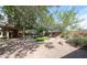 Expansive backyard with lush landscaping and artificial turf for easy maintenance at 11034 W Sierra Pinta Dr, Peoria, AZ 85373