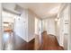 Hallway features wood floors, archways, and access to multiple rooms at 11034 W Sierra Pinta Dr, Peoria, AZ 85373