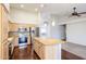 Spacious kitchen with stainless steel appliances, granite countertops and a large island at 11034 W Sierra Pinta Dr, Peoria, AZ 85373