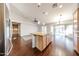 Open kitchen boasts center island with light countertops and stainless steel appliances at 11034 W Sierra Pinta Dr, Peoria, AZ 85373