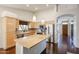 Well-equipped kitchen featuring granite countertops, stainless steel appliances, and a center island at 11034 W Sierra Pinta Dr, Peoria, AZ 85373