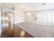 Open-concept living area featuring hardwood floors and lots of natural light at 11034 W Sierra Pinta Dr, Peoria, AZ 85373