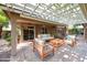 Inviting covered patio with stylish furniture, perfect for outdoor relaxation and entertaining at 11034 W Sierra Pinta Dr, Peoria, AZ 85373