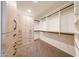 Well-organized walk-in closet with custom shelving and ample storage space, finished with neutral carpeting at 11034 W Sierra Pinta Dr, Peoria, AZ 85373