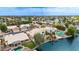 Desirable waterfront house with pool, private dock and lush landscaping on a sunny day at 1146 W Sea Fog Dr, Gilbert, AZ 85233