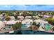 Gorgeous waterfront home featuring a pool, boat dock, and lovely landscaping at 1146 W Sea Fog Dr, Gilbert, AZ 85233