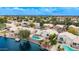 Waterfront house features a private pool, boat dock, and well-maintained landscaping with neighborhood view at 1146 W Sea Fog Dr, Gilbert, AZ 85233
