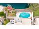 Aerial perspective of backyard featuring a private pool, dock, patio, and landscaped yard at 1146 W Sea Fog Dr, Gilbert, AZ 85233
