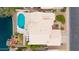 Aerial view of a home featuring a private pool, waterfront access, and landscaped backyard at 1146 W Sea Fog Dr, Gilbert, AZ 85233
