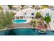 Stunning waterfront home boasts a private pool, dock, and lush landscaping, perfect for outdoor living and entertaining at 1146 W Sea Fog Dr, Gilbert, AZ 85233