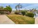 Lush backyard featuring a manicured lawn and access to the serene lake at 1146 W Sea Fog Dr, Gilbert, AZ 85233