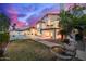 Expansive backyard featuring a pool, patio, and lush landscaping, perfect for outdoor entertaining at 1146 W Sea Fog Dr, Gilbert, AZ 85233