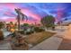 Landscaped backyard with water feature and lake views, ideal for enjoying the outdoors at 1146 W Sea Fog Dr, Gilbert, AZ 85233