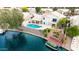 This waterfront property offers a private pool, boat dock, and outdoor living space for relaxing or entertaining at 1146 W Sea Fog Dr, Gilbert, AZ 85233