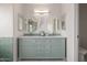 Elegant bathroom vanity featuring dual sinks, ample storage, and stylish mirrors at 1146 W Sea Fog Dr, Gilbert, AZ 85233