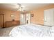 Bright bedroom features plush carpet, an ornate dresser, and access to the en-suite bathroom at 1146 W Sea Fog Dr, Gilbert, AZ 85233