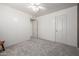 Bedroom features plush neutral carpeting, an en-suite bathroom, and two interior doors at 1146 W Sea Fog Dr, Gilbert, AZ 85233