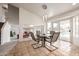 Bright dining area with waterfront views, featuring tiled floors and modern lighting at 1146 W Sea Fog Dr, Gilbert, AZ 85233