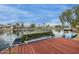 Charming dock with a covered boat and a view of the lake at 1146 W Sea Fog Dr, Gilbert, AZ 85233