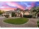 This delightful residence features a well-kept lawn and a convenient two-car garage with beautiful sunset views at 1146 W Sea Fog Dr, Gilbert, AZ 85233