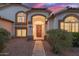 Charming single-story home with desert landscaping, arched entry, and inviting curb appeal at 1146 W Sea Fog Dr, Gilbert, AZ 85233