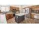 Cozy kitchen featuring tile floors, ample cabinet space, and modern appliances at 1146 W Sea Fog Dr, Gilbert, AZ 85233