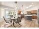 Eat-in kitchen features tile floors, wood cabinets, modern appliances, and water views at 1146 W Sea Fog Dr, Gilbert, AZ 85233