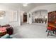 Open-concept living room featuring plush carpeting, archways, and ample natural light at 1146 W Sea Fog Dr, Gilbert, AZ 85233