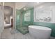 Stunning bathroom featuring a glass-enclosed shower and soaking tub at 1146 W Sea Fog Dr, Gilbert, AZ 85233