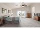 Bright main bedroom with vaulted ceiling, ceiling fan, and balcony access at 1146 W Sea Fog Dr, Gilbert, AZ 85233