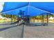 Community playground featuring a covered play structure and a sandy play area for children to enjoy at 1146 W Sea Fog Dr, Gilbert, AZ 85233