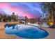 Stunning pool overlooking a picturesque lake view, creating a serene and private oasis at 1146 W Sea Fog Dr, Gilbert, AZ 85233