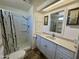 Well-lit bathroom featuring a walk-in shower, vanity with storage, and a mirror, offering a clean design at 120 N Val Vista Dr # 151, Mesa, AZ 85213
