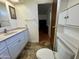Bright bathroom with a vanity, a mirror, and open doorway, offers comfort and functionality at 120 N Val Vista Dr # 151, Mesa, AZ 85213