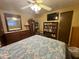 This bedroom features a ceiling fan and a wooden bookshelf at 120 N Val Vista Dr # 151, Mesa, AZ 85213