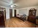 Bright bedroom featuring a bed, storage cabinet and fan with a light fixture at 120 N Val Vista Dr # 151, Mesa, AZ 85213