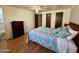 Comfortable bedroom features closet space, a ceiling fan, and natural light from the window, perfect for relaxation at 120 N Val Vista Dr # 151, Mesa, AZ 85213